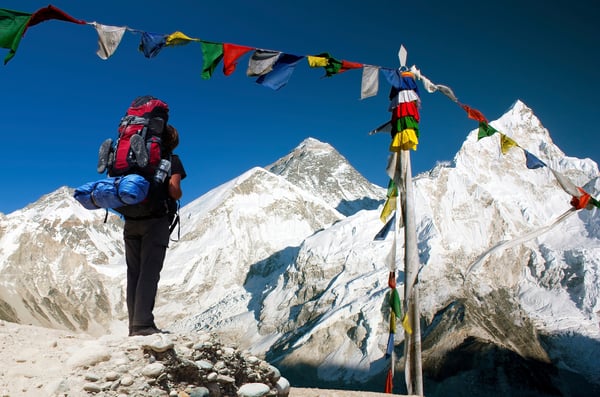 Hiker looking up at Mount Everest