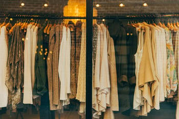 Women's clothing hanging in store window