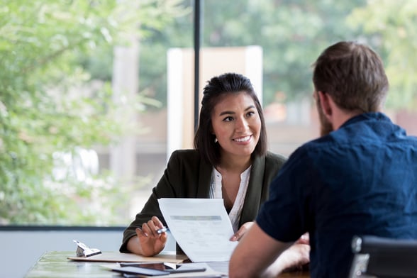 Woman and man at job interview meeting