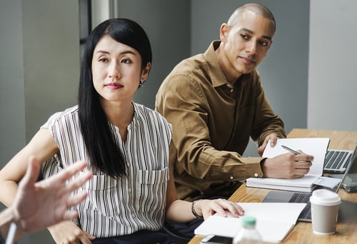 Man and woman at business meeting